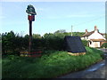 Village Sign And well in NR15 2AB