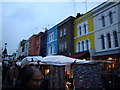 Coloured buildings on Portobello Road in W11 4EH