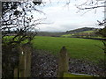 Stile and footpath across fields to Shaw Wood in DE55 7RN
