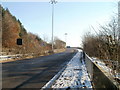 Clear roadway and snowy pavement, A4054 near Tongwynlais in CF15 8LB