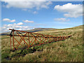 Toppled pylon on west side of Great Dun Fell in Milburn