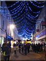 Christmas late night shopping in Market Street Falmouth in TR11 2BP