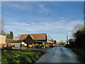 Farm building beside the road at S. E. St James in IP19 0HG