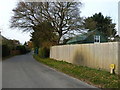 Looking from Woodmancote Lane towards the church in PO10 8RD