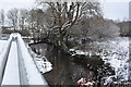 The view downstream from a footbridge on the river Caen, near Tesco Supermarket in EX33 2ES