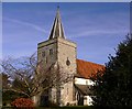 Binsted church seen from the burial ground in GU34 4PD