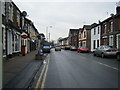 Cardiff Road with Taffs Well Post Office on the left in CF15 7QR