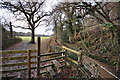 A stile next to a leat on the outskirts of Tutshill Wood in EX31 1AG