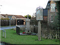 Sutton St Edmund Village sign and War Memorial in Sutton St Edmund