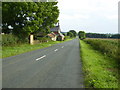 Straight road passing East Kingthorpe downhill to Thornton le Dale in YO18 7LN