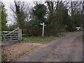 Footpath sign on Christmas Hill at the entrance to Little Tangley Nursery in GU4 8LY