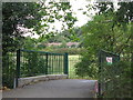 Footbridge over the River Ravensbourne in Queen's Mead in BR1 3QA