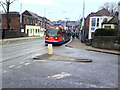 Supertram 104 passes Minto Road Dental Care on Middlewood Road in S6 2HH