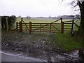 Gate to footpath at Wintershall in GU5 0FE