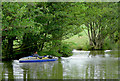 Very narrow boat on the canal near Alvechurch, Worcestershire in B48 7DE