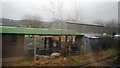 Farm buildings by the railway line in GU4 8AJ
