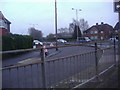 Junction of Robinsway and Queensway, Hersham in KT12 4LA
