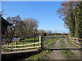 Gate and footpath alongside the Afon Dyfrdwy/River Dee in LL13 0AT