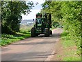 Tractor with cultivator on Harrowden Road, Finedon in NN9 5LW