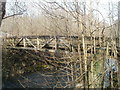 Side view of wooden bridge above Ebbw River, Newbridge  in NP11 5GB