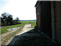 Track past barn at Forest Farm, Wood Salling in Eynesford Ward