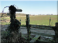 Footpath sign and stile at Friston, Suffolk in IP17 1PU