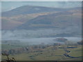 Morning mist across the Lune Valley from Hutton Roof Crag in LA6 2PN