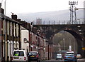 Street, railway viaduct and communications mast in BL2 2HW