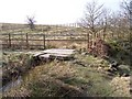 Stone slab footbridge near Owlet Hall in OL15 0JS