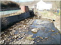 Rhondda Fawr river emerges from under Blaenrhondda Road, Blaenrhondda in Treherbert Community