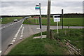 A multitude of signs at the A4074-Icknield Road junction in OX10 6AS