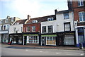 Row of listed shops, High St in TN9 1NY