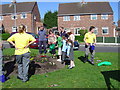 Youatt Avenue - Flower planting on the green in Prescot