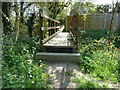 Footbridge by last garden in Daux Avenue in RH14 9TB