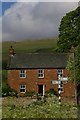 View of House and Melmerby Low Scar from Melmerby Green in CA10 1HL