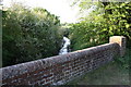 Bradford's Brook visible over the parapet of the Hithercroft Road bridge in OX10 9GL