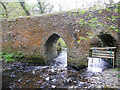 Abbey River beneath narrow bridge in EX39 6DS