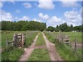 Footpath crosses farm track near Burscough Hall Farm in L40 5TD