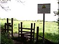 Warning sign at stile near Chapel Lane in L40 5TD