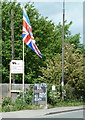 Signs and flag by Chesterfield Road in S42 5TG
