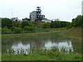 Pool, line of old railway, and industrial works, Staveley in S43 2NL