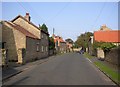 The village street to the west of the church, Hutton Buscel in YO13 9LN