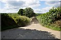 North Cornwall : Country Road & Tractor in PL30 4QZ