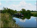 The Thames and a narrowboat near Kelmscott in GL7 3HQ