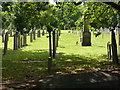 Gravestones and red flowers, Derby Cemetery in DE21 6YZ