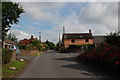 Road and Red Brick House, Preston upon the Weald Moors in TF6 6EH