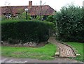 Winding garden path to Rosemary Cottage in GU6 8EZ