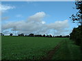 Power lines across green fields in IP7 7JR
