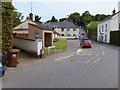 Cullompton Hill, milestone and bus shelter in EX5 4NZ