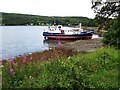 Foreshore and grounded fishing boat at Garelochhead in G84 0AE